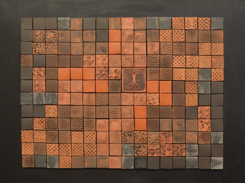 Handmade tile mosaic in terra cotta and black with world tree focal point